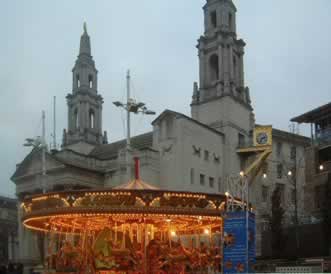 Fairground in front of Leeds Civic Hall