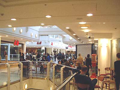 Photograph of Leeds Shopping Plaza with one of the cafes on the right